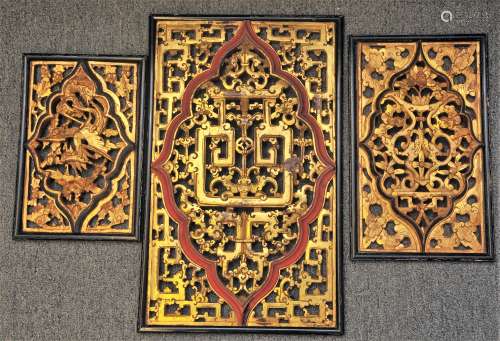 Lot of three Architectural elements. China. 20th century. Carved and pierced wood with red and black lacquer with gilt. Largest- 22