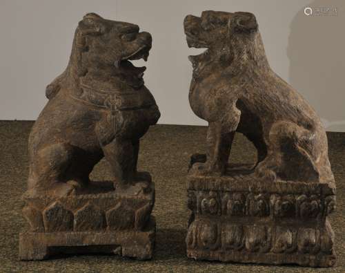 Pair of guardian lions. China. 19th C. Carved stone. 21