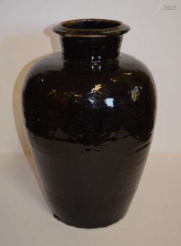Stoneware storage jar. China. 19th century or earlier. Northern blackware. Small  chip at the mouth. 21
