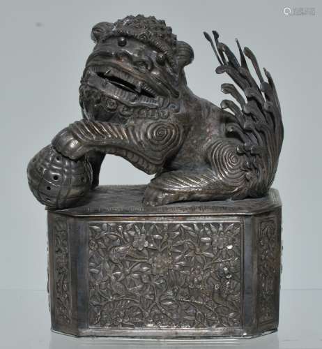 Silver box. China. 19th century. Repousse work. Decoration of birds and flowers with a foo dog finial. Signed. Weight- 12.38 oz.