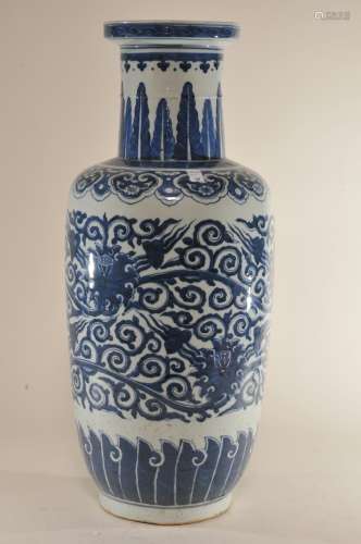 Porcelain vase. China. 19th century. Underglaze blue decoration of lotus scrolls. Ju-i and acanthus leaf borders. Hsuan Te mark. Drilled for a lamp.
