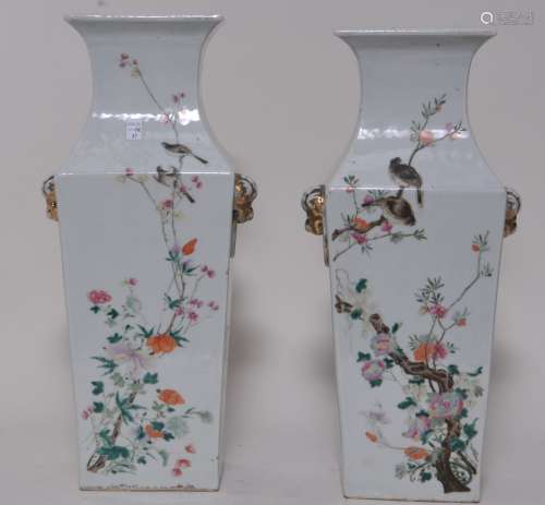Pair of porcelain vases. China. Early 20th century. Square form with lion mask handles. Famille Rose decoration of birds and flowers with poems. Drilled. 16