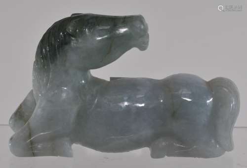 Jade carving. China. 20th century. Study of a reclining horse. Green stone with darker green markings. 4
