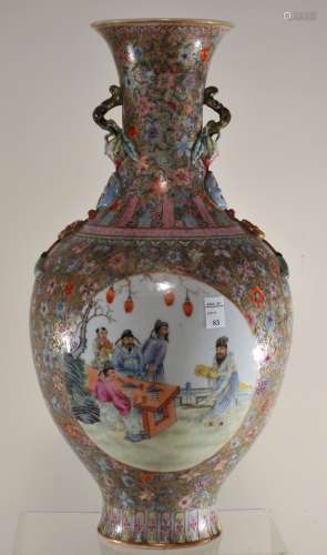 Porcelain vase. China. Republic period. Circa 1920. Globular body with a slightly flaring neck, moulded decoration of a branch of peaches, shou medallions, and tasselled cash coins. Fan Tsai reserves of scholars, women, and children, all on a gilt ground with famille rose (100 flowers). Chien Lung mark on base. 13.5