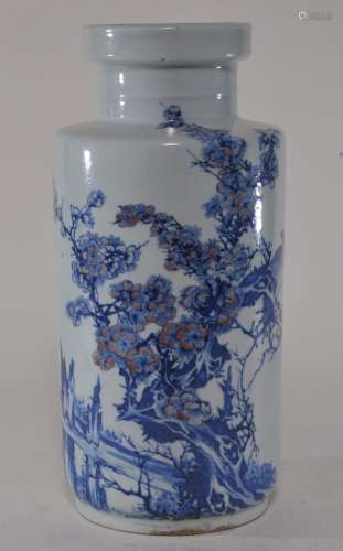 Porcelain vase. China. 18th century. Roleau form. Underglaze blue and red decoration of a bird in a flowering prunus tree. K'ang Hsi mark. Drilled for a lamp. 11-3/4