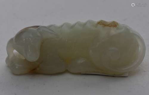 Jade study of a dog. China. 19th century. White stone with russet markings. 2