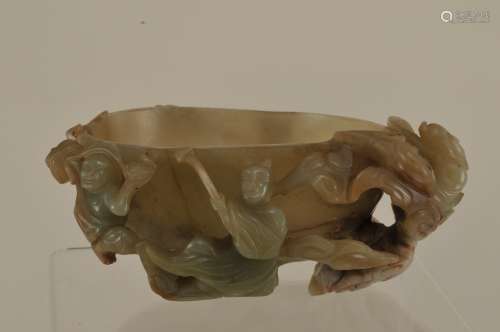 Jade coupe. Ming Period (1368-1644). Peach shaped bowl with foliage and immortals. 5-1/4