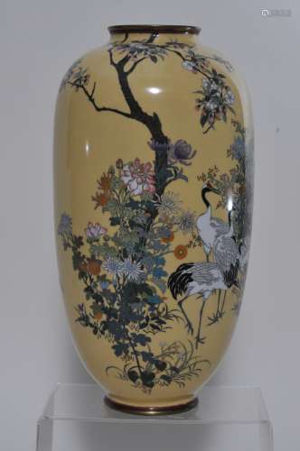 Cloisonne vase. Japan. Meiji period. (1868-1912). Pale mustard yellow ground. Decoration with cranes and flowering plants. Silver wire work. Two age lines. 12