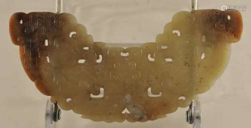Archaic ritual jade. China. Sung period (960-1279). Huang carved with fish tailed Keui dragons with archaic scrolling's. Yellow green color with black and russet markings. 5-3/4