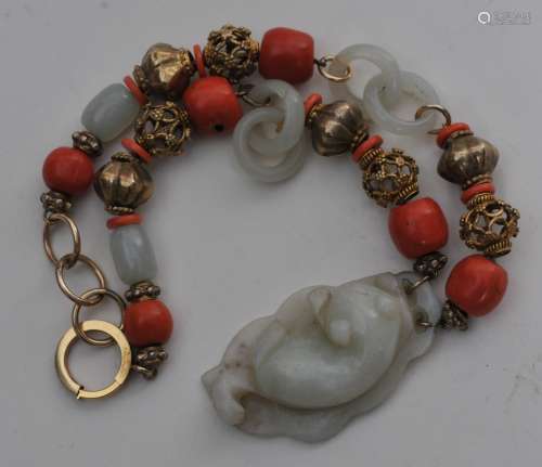 Necklace. China. 19th century. White jade (cat pendant, rings and beads; coral beads and gilt metal beads).