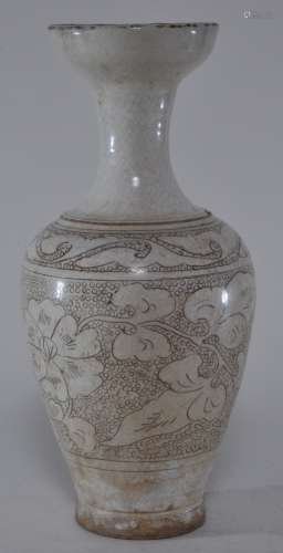 Stoneware vase. China. Sung period (960-1279). Tzu chou ware. Cream coloured glaze with brown scrafitto decoration of floral scrolls on a punched fish roe ground. 11-3/4