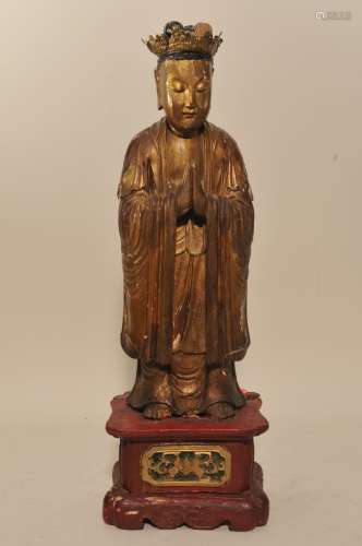 Carved wooden figure of a Accolyte. China. 19th century. Standing figure. Surface decorated with red and gold lacquer. 24