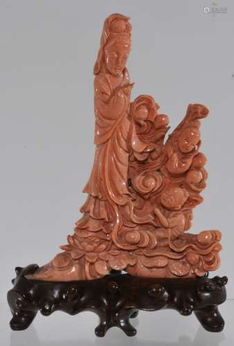 Coral carving. China. Early 20th century. Salmon colour. Figure of Kuan Yin with two attendants. 6