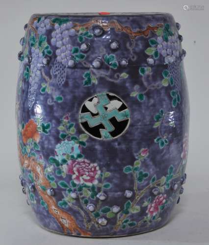 Porcelain garden seat. China. Early 20th century. Ta Ya Chai type. Drum form. Wan shaped piercings. Decoration of wisteria and peonies on a lavender  ground. 13