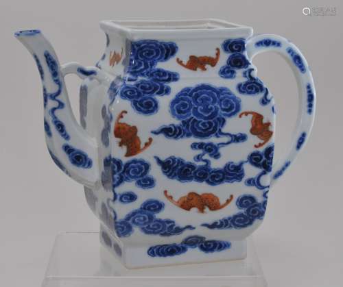 Porcelain teapot. China. Hsuan Tung mark (1908-1912) and of the period. Underglaze blue clouds with iron red bats with gilt. 5-3/4