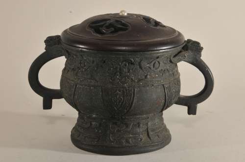 Bronze censer. China. 19th century. Archaic Kuei shape. Wooden cover carved and set with a pearl. 7