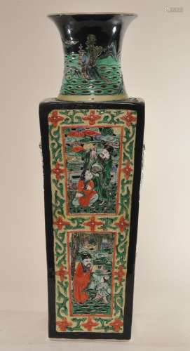 Porcelain vase. China. 19th C or earler. Square shape. Moulded decoration of The Immortals with children. Black ground with san Tsai colours. 20