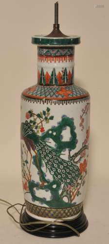 Porcelain vase. China. 19th century. Roleau form. Famille Rose decoration of flowering trees. Drilled and mounted as a lamp. 19