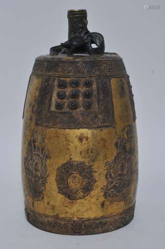 Bronze bell. Korea. 19th century. Surface decorated with Buddhist apsaras, floral motifs with grape vine borders. Dragon finial. Gilt surface. 14-1/2