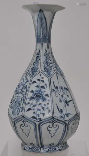 Porcelain vase. China, 20th century. Yuan style underglaze blue floral decoration. Faceted bottle shape with a flaring mouth. 11