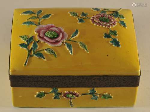 Porcelain box. China. 19th century. Rectangular form with relief flowers in Famille Rose enamels. 4-3/4
