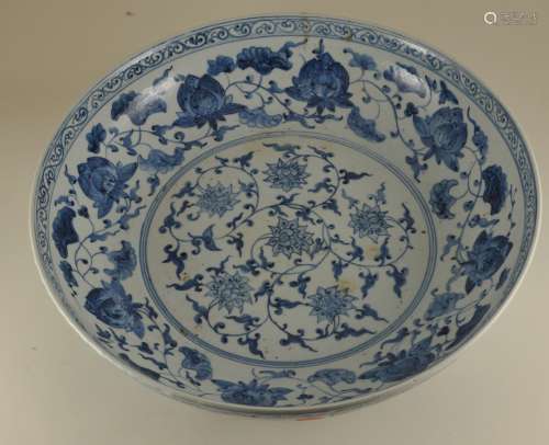 Porcelain bowl. China. 20th century. Underglaze blue decoration . Early Ming style floral scrolling. 14-1/2