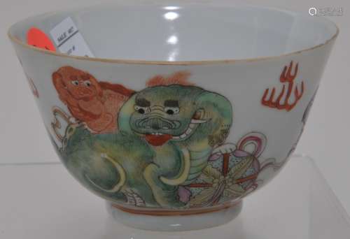 Porcelain bowl.  China. Late 19th century. Famille Rose decoration of foo dogs and brocade balls. Ch'ien Lung mark. 4-1/2