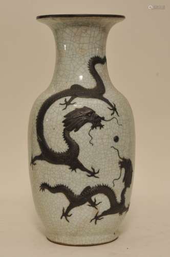 Porcelain vase. China. 19th to early 20th century. Brown relief dragons on a white crackled ground. Ch'eng Hua mark. Drilled for a lamp. 18