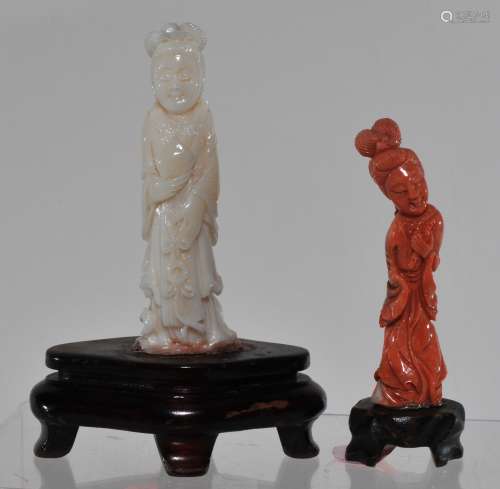 Two coral carvings. China. 20th century. Figures of women. One salmon coloured, the other angel skin colour. Each about 3-1/2