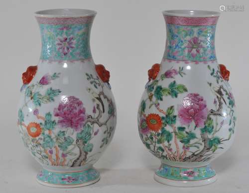 Pair of porcelain vases. China. Early 20th century. Hu form foo dog mask handles. Famille Rose decoration of birds and flowers. 9