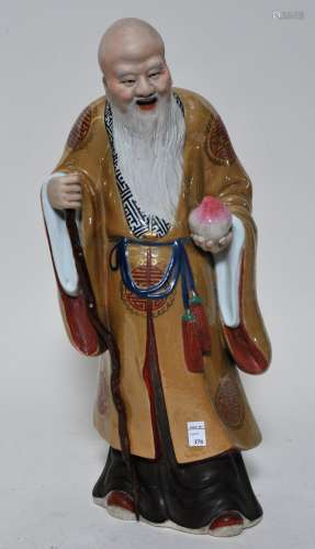 Porcelain figure. China. 20th century. Standing figure of Shao Lao with café au lait robes. 15