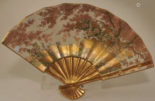 Stoneware dish. Japan. Meiji period (1868-1912). Satsuma ware. Fan shaped. Decoration of peacocks and flowering trees. 20
