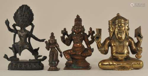 Lot of four bronze divinities. To include: Three Indian bronzes, 19th/early 20th century (Brahma, Vishnu and Durga) Together with a 19th to early 20th century figure of Yana. Largest- 5-1/2