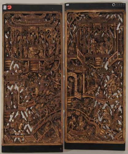 Two architectural elements. China. 19th to early 20th century. Wooden panels carved and pierced with historical scenes with red and black lacquer and gilded. 27-1/2