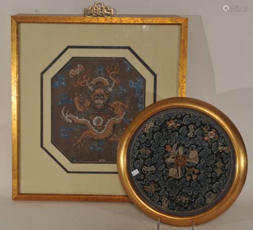 Two embroideries. China. 19th century. A round festival badge and a panel with a dragon. Framed and glazed. Stains and lose threads. SIZE