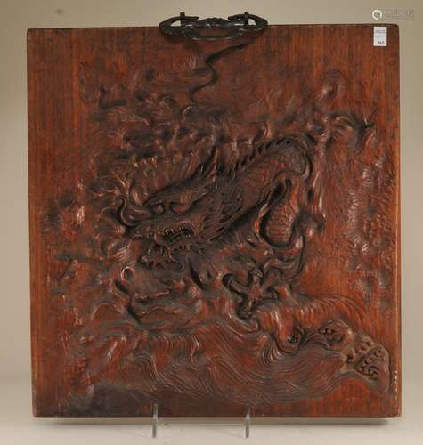 Carved wooden plaque. Japan. Meiji period. (1868-1912). Surface carved with a dragon. Bronze hanger. 15-1/2