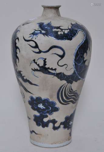 Porcelain vase. China. 20th century. Yuan/Early Ming style decoration of a dragon and clouds on an unglazed ground. Signed. 13-1/2