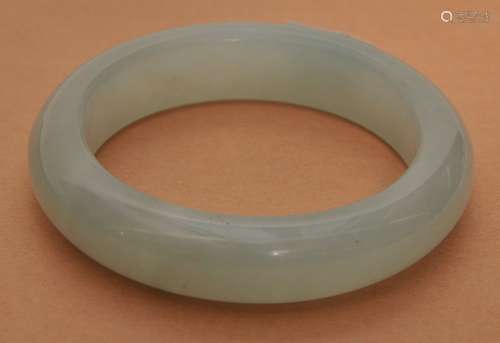 Jade bracelet. Highly translucent blue and white color.