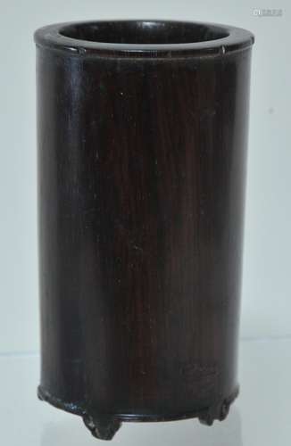 Rosewood brush holder. China. 19th century. Cylindrical form with five feet. One foot missing. 2-1/4