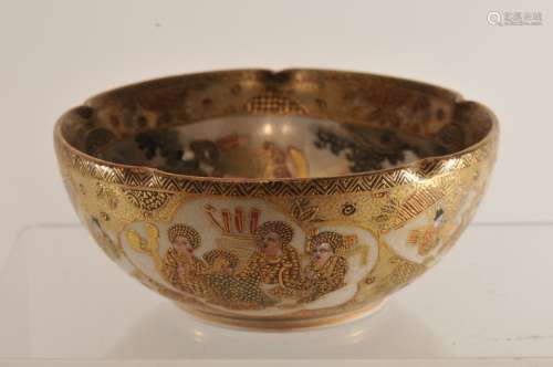 Pottery bowl. Japan. Meiji period. (1868-1912). Decoration of Buddhist saints. Foliate edge. Signed. 4-1/4