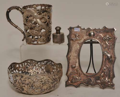 Lot of four pieces of Chinese Export silver. To include: Two shells, a salt shaker and a picture frame.