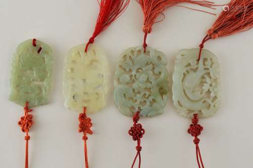 Four Chinese carved celadon coloured hard stone figural animal decorated pendants. Longest- 2-3/4