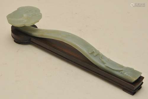 Jade scepter. China. 19th century. Pale celadon coloured stone. Ju-i carved with a fish and a raptor. 15-1/2