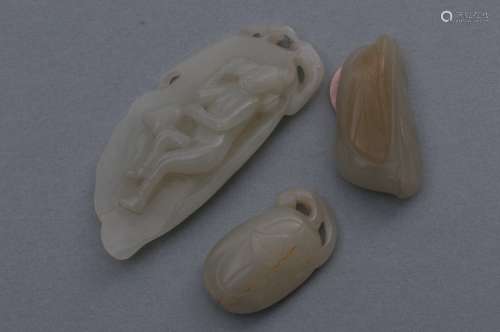 Lot of three jade carvings. China. 19th century. To include: A female figure on a leaf and two fruits. Largest- 3-1/4