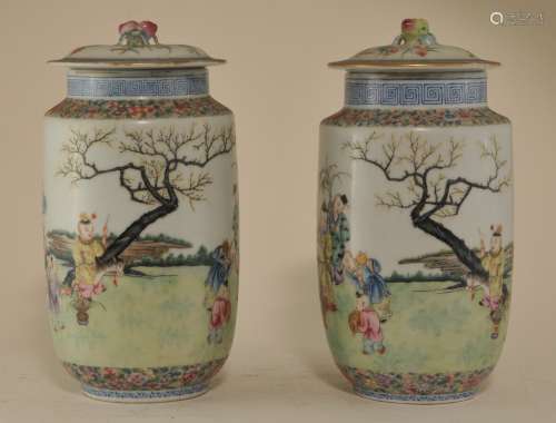 Pair of Chinese Republic Period fine quality round covered Famille Rose porcelain jars with Hundred Boys decoration. Peach form finials. On bases. 9-3/4