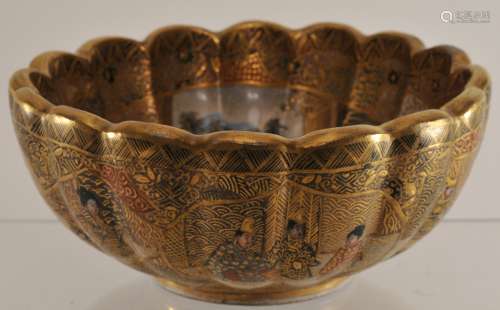 Pottery bowl. Japan. Meiji period. (1868-1912). Lobated form. Decoration of women and children on a gold brocade ground. Signed. 5