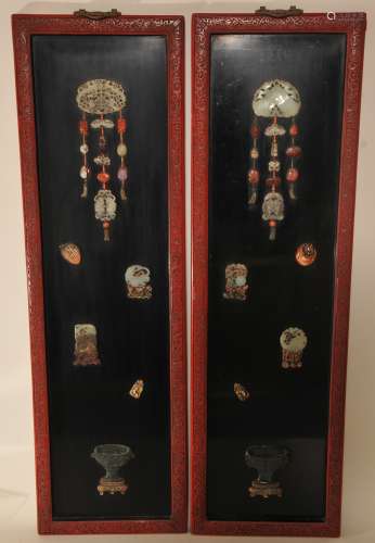 Pair of rectangular wall plaques. China. Early 20th century. Cinebar frames inset with The Hundred Antiques. Inlaid in jade, carnelian, amethyst and other stones. 43-1/2