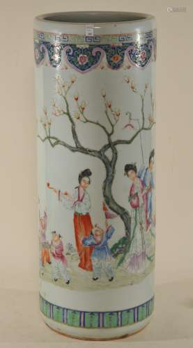 Porcelain umbrella stand. China. Early 20th century. Cylindrical form. Famille Rose decoration of women and children. 23