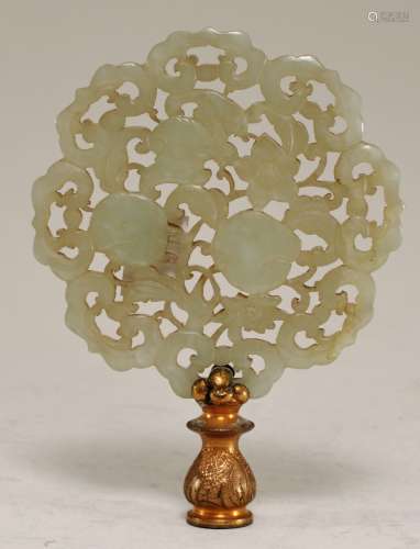 Jade pendant. China. 19th century. Greenish white stone. Carved and pierced with bats, peaches, flowers and ju-i. Mounted as a lamp finial.  3-1/4