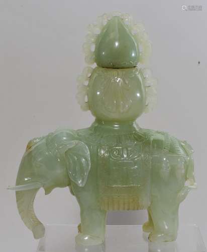 Hardstone carving. China. 20th century. Study of a caparisoned elephant. Stone of pale yellow green colour. 7